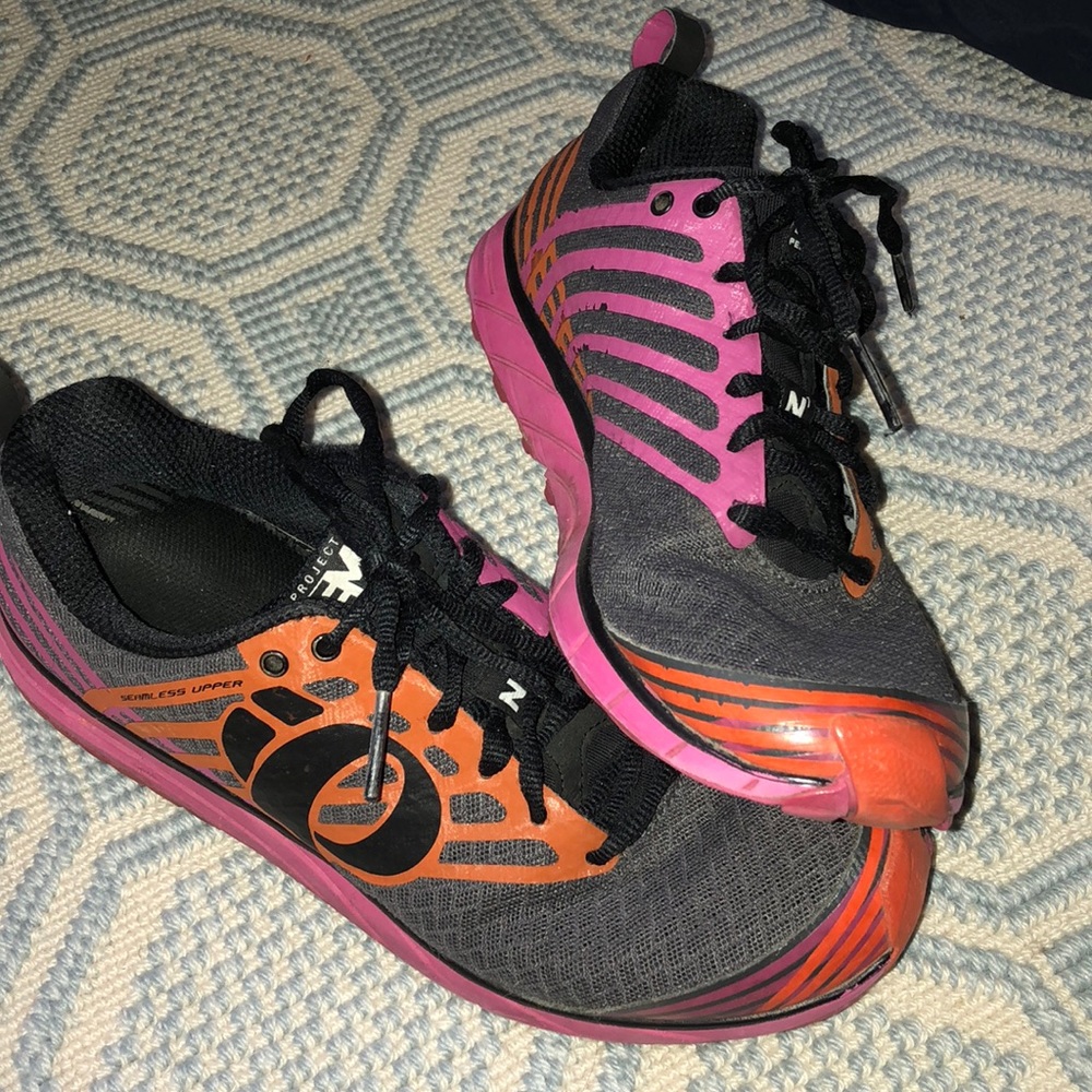 Running sneakers with orange and pink detailing